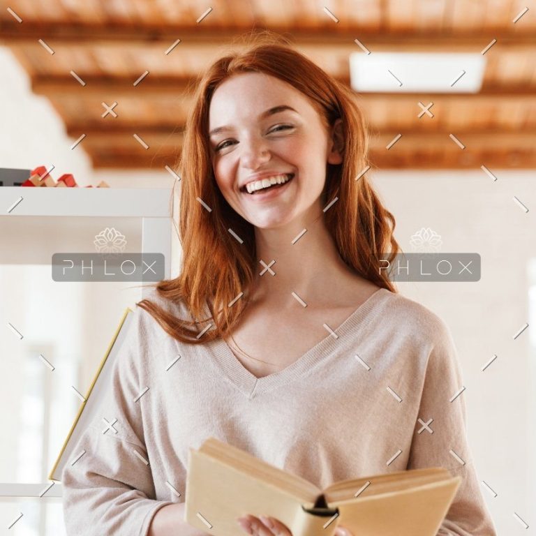 demo-attachment-445-happy-redhead-young-lady-student-reading-book-M5Z7RVC@2x-1